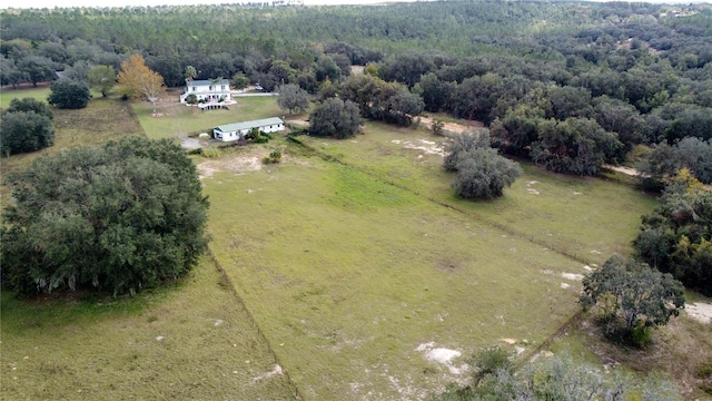 birds eye view of property with a rural view