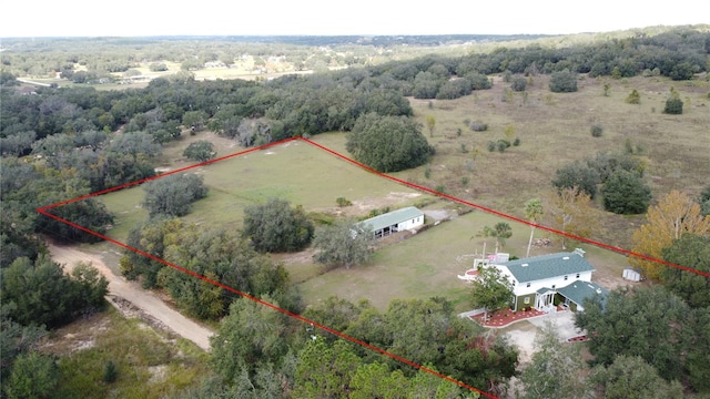 birds eye view of property featuring a rural view