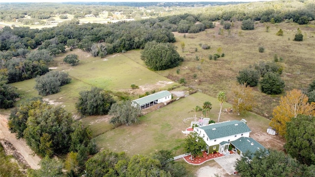 birds eye view of property with a rural view