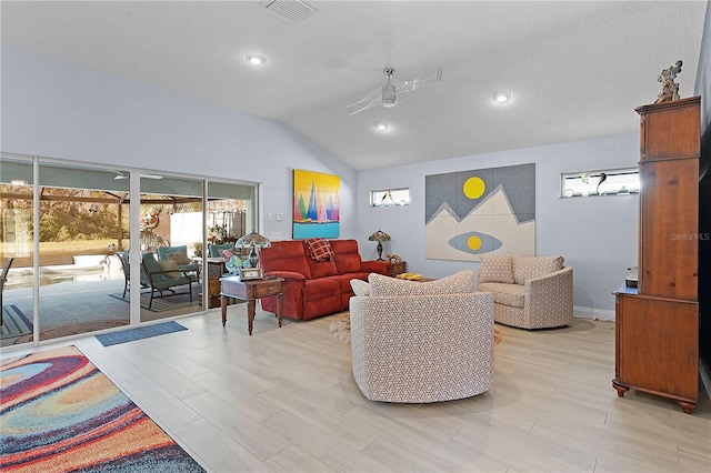 living room with light hardwood / wood-style floors and vaulted ceiling