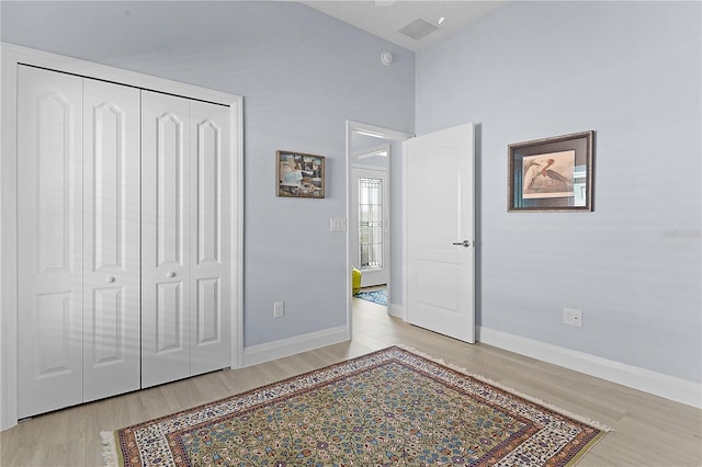 bedroom featuring a closet and light hardwood / wood-style flooring