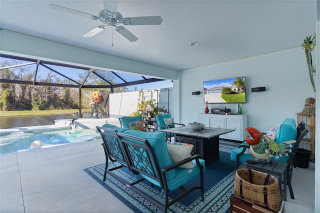 view of patio / terrace featuring outdoor lounge area, pool water feature, glass enclosure, and ceiling fan