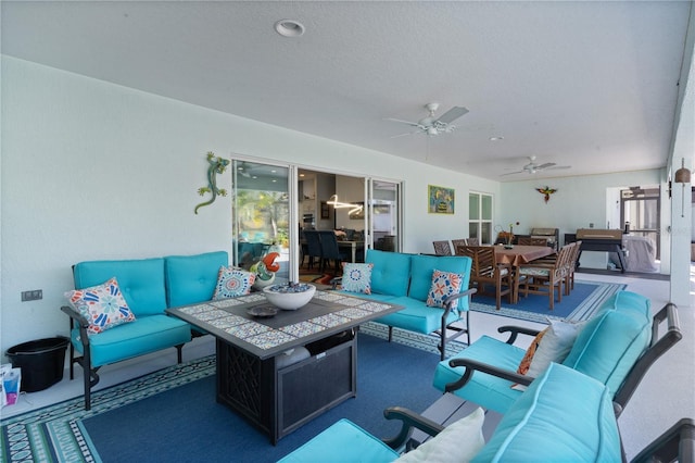 carpeted living room featuring ceiling fan