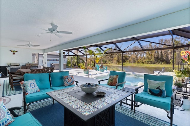 view of patio / terrace featuring an outdoor hangout area, a water view, glass enclosure, and ceiling fan