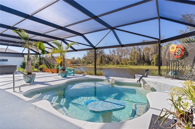 view of pool with glass enclosure, a patio area, and a water view