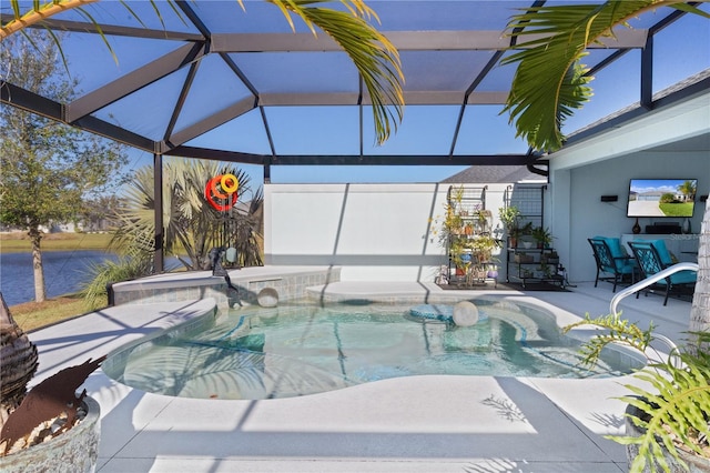 view of swimming pool with a patio area, a lanai, and a jacuzzi