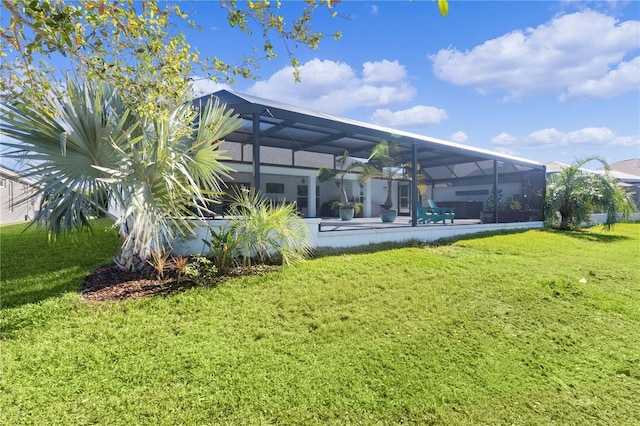 view of yard featuring glass enclosure and a pool