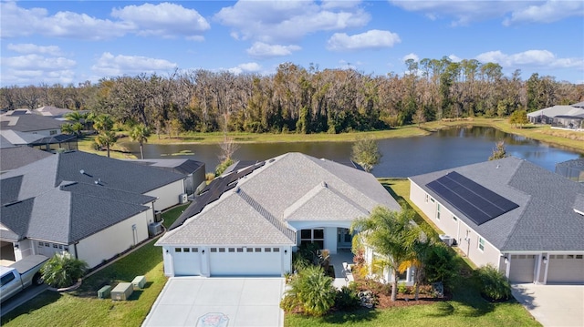 birds eye view of property with a water view