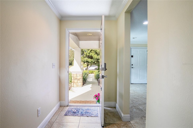 entryway featuring light tile patterned floors and crown molding