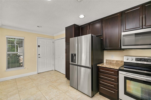 kitchen with dark brown cabinetry, appliances with stainless steel finishes, a textured ceiling, light tile patterned floors, and ornamental molding