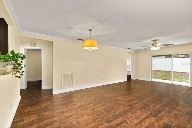 empty room featuring dark hardwood / wood-style floors, ceiling fan, and crown molding