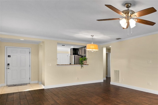 unfurnished living room featuring dark hardwood / wood-style floors, ceiling fan, and crown molding