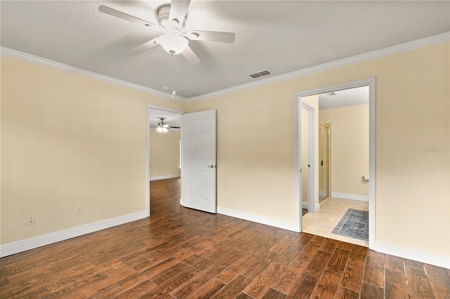 unfurnished room featuring hardwood / wood-style floors and ornamental molding