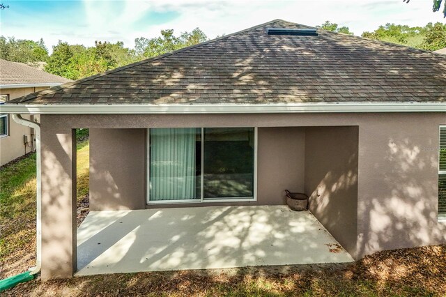 rear view of house with a patio