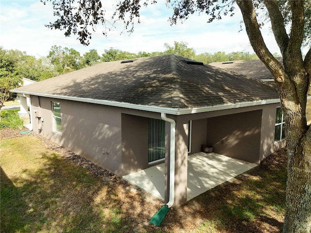 view of property exterior featuring a patio