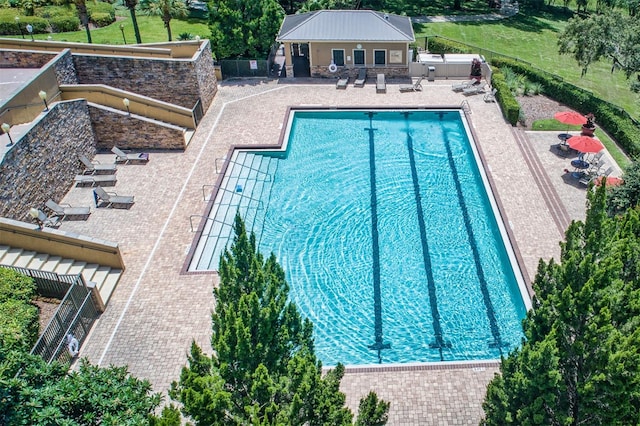 view of swimming pool with a patio