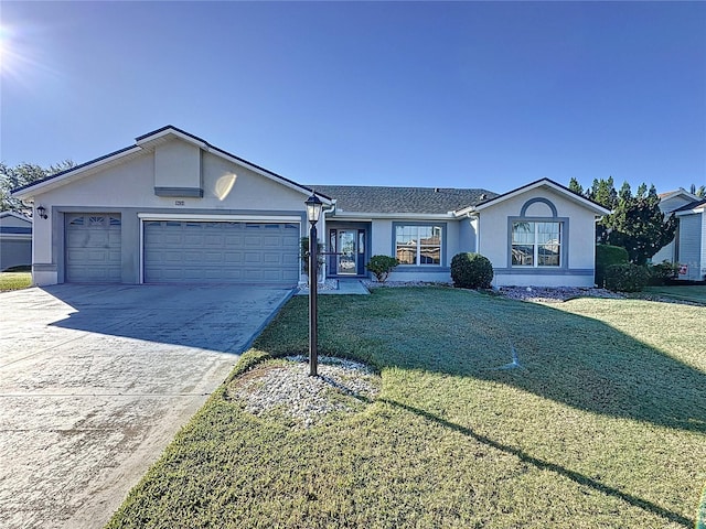 ranch-style home with a garage and a front yard