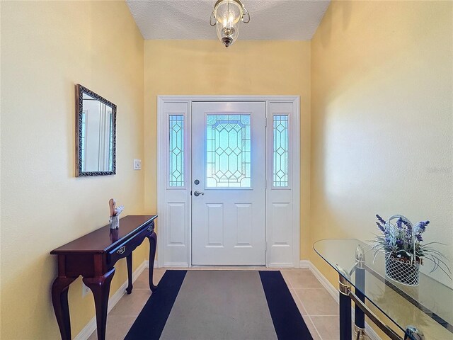 4634 Summerbridge Cir, Leesburg, FL 34748 - tiled entrance foyer with baseboards and a textured ceiling