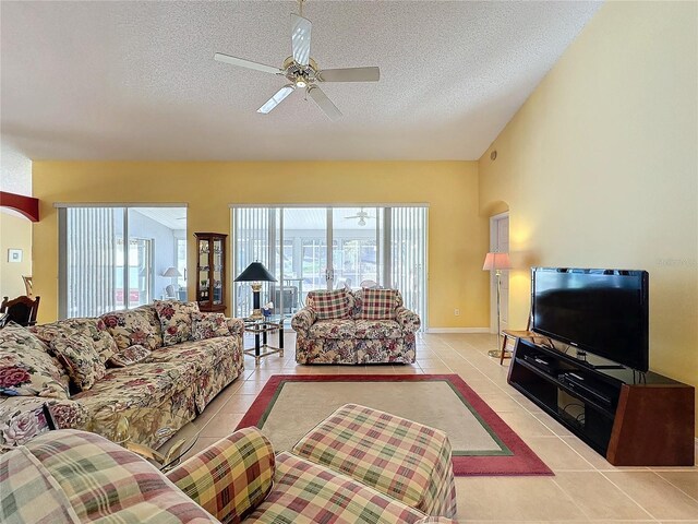 4634 Summerbridge Cir, Leesburg, FL 34748 - living area featuring light tile patterned flooring, a ceiling fan, and a textured ceiling