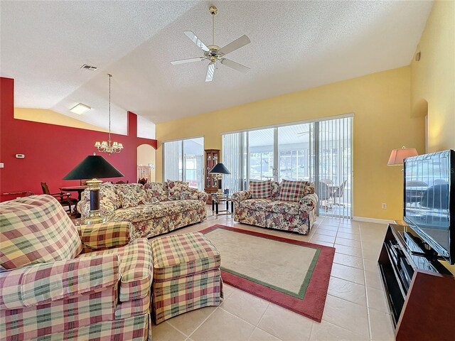 4634 Summerbridge Cir, Leesburg, FL 34748 - living area featuring lofted ceiling, ceiling fan, light tile patterned floors, a textured ceiling, and a chandelier