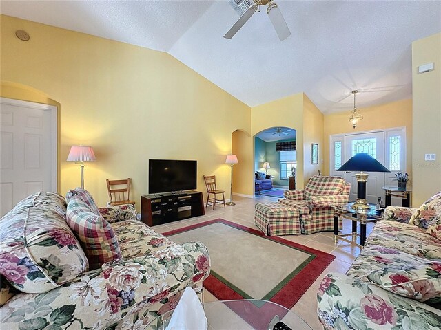 4634 Summerbridge Cir, Leesburg, FL 34748 - tiled living room with arched walkways, vaulted ceiling, and a ceiling fan