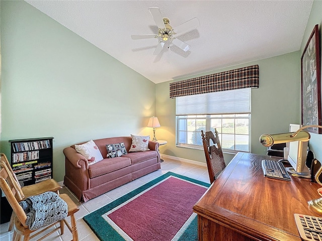 tiled home office featuring ceiling fan and a textured ceiling