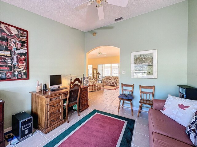 4634 Summerbridge Cir, Leesburg, FL 34748 - tiled home office featuring a ceiling fan, arched walkways, and a textured ceiling