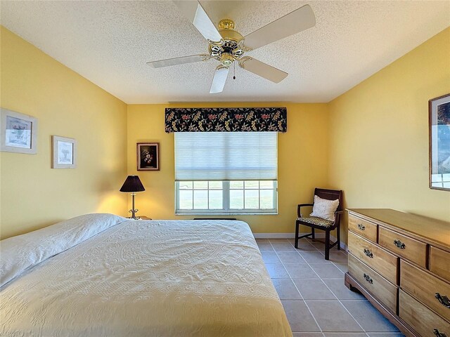 4634 Summerbridge Cir, Leesburg, FL 34748 - tiled bedroom featuring a textured ceiling and ceiling fan
