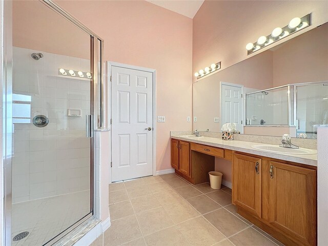 4634 Summerbridge Cir, Leesburg, FL 34748 - bathroom featuring a shower stall, tile patterned floors, double vanity, and baseboards