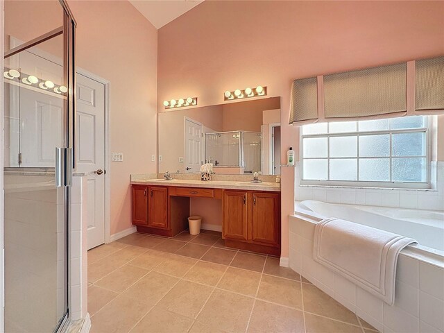 4634 Summerbridge Cir, Leesburg, FL 34748 - full bathroom with a garden tub, a stall shower, tile patterned flooring, double vanity, and lofted ceiling