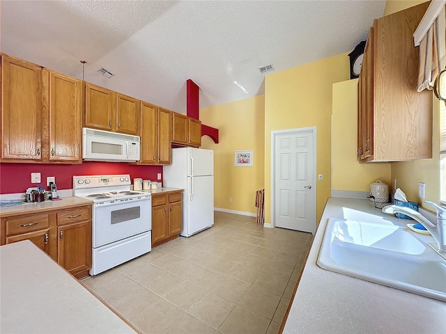 4634 Summerbridge Cir, Leesburg, FL 34748 - kitchen featuring white appliances, a sink, vaulted ceiling, light countertops, and light tile patterned floors