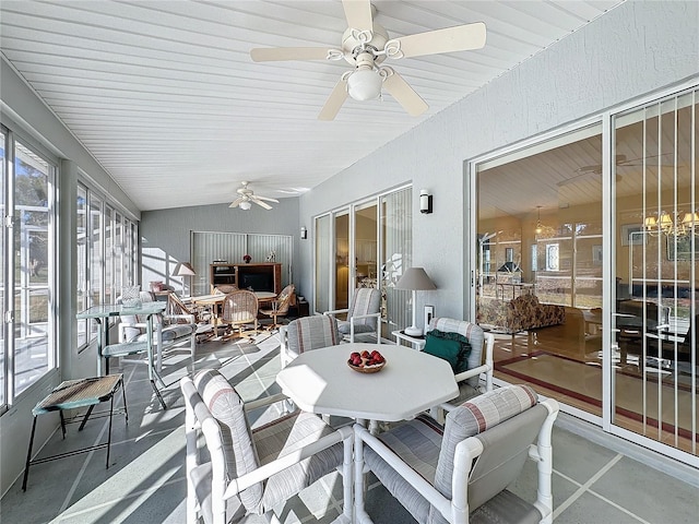 sunroom / solarium featuring ceiling fan and lofted ceiling