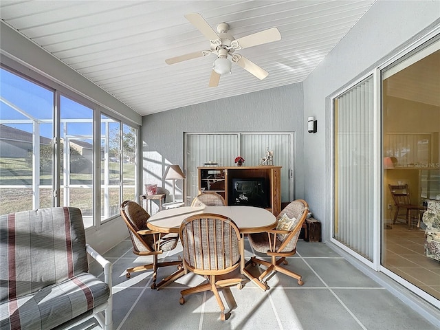 sunroom / solarium featuring ceiling fan and lofted ceiling