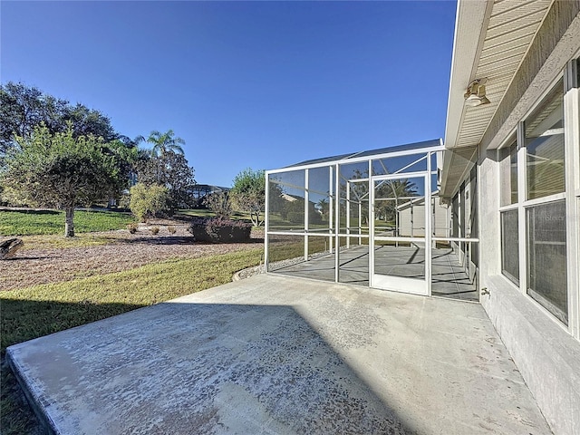 view of patio / terrace with glass enclosure