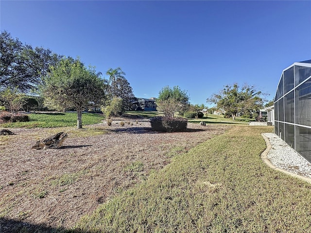 4634 Summerbridge Cir, Leesburg, FL 34748 - view of green lawn featuring glass enclosure