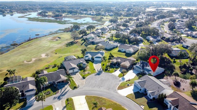 4634 Summerbridge Cir, Leesburg, FL 34748 - aerial view of property's location with nearby suburban area, a nearby body of water, and a golf course