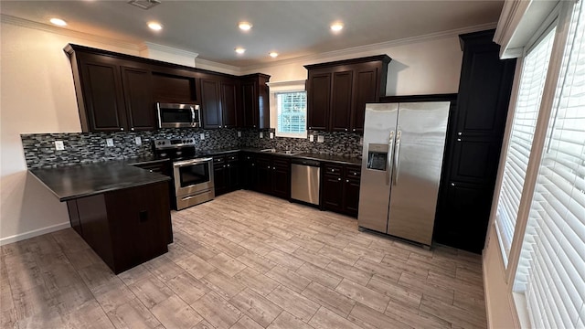 kitchen with crown molding, light wood-type flooring, appliances with stainless steel finishes, tasteful backsplash, and dark brown cabinets