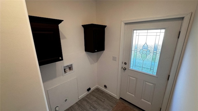 laundry area featuring dark hardwood / wood-style flooring, cabinets, and hookup for a washing machine