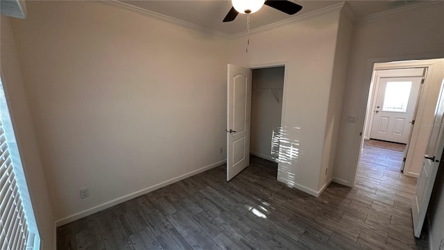 unfurnished bedroom with ceiling fan, ornamental molding, dark wood-type flooring, and a closet