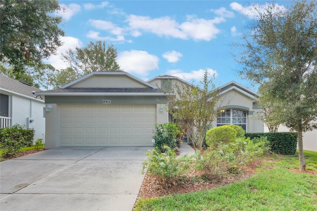 single story home featuring a garage