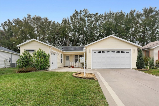 single story home featuring solar panels, central AC, a front lawn, a garage, and a porch