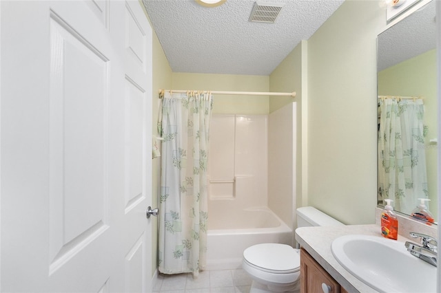 full bathroom with tile patterned floors, shower / bath combination with curtain, a textured ceiling, toilet, and vanity