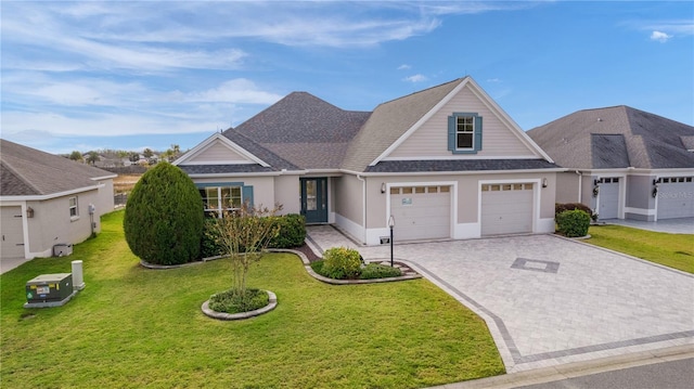 view of front facade with a garage and a front lawn