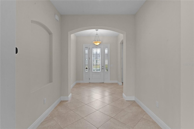 foyer featuring light tile patterned floors