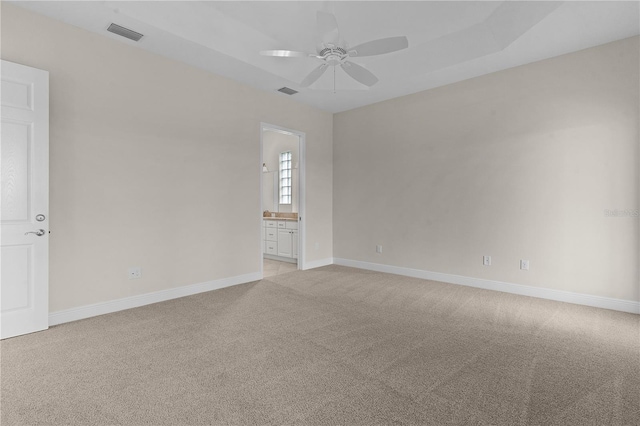 unfurnished room featuring ceiling fan and light carpet