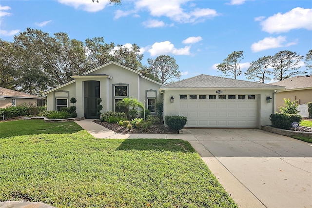 single story home featuring a garage and a front yard