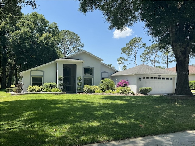 view of front facade featuring a front yard and a garage