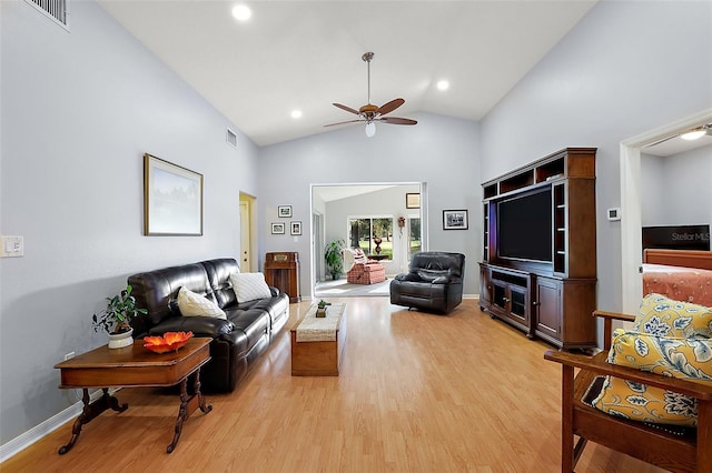 living room featuring ceiling fan, light hardwood / wood-style flooring, and high vaulted ceiling