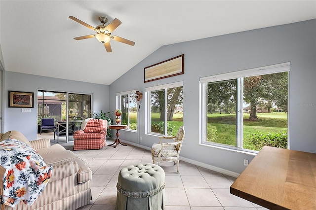 sunroom featuring ceiling fan and lofted ceiling