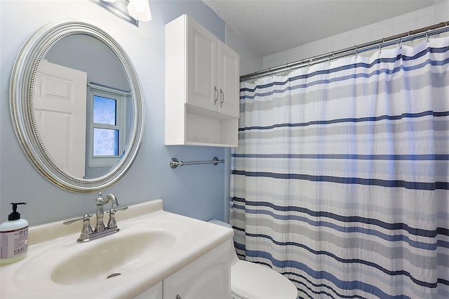 bathroom featuring vanity, a textured ceiling, toilet, and a shower with shower curtain